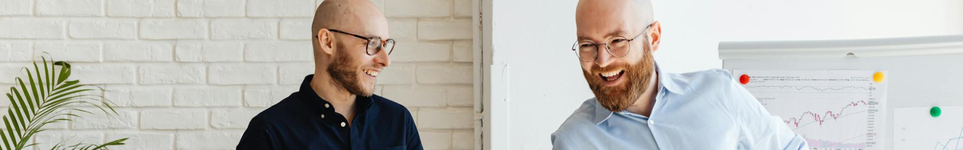 Colleagues discussing cybersecurity insights and building trust while reviewing data during a vCISO‑guided meeting.