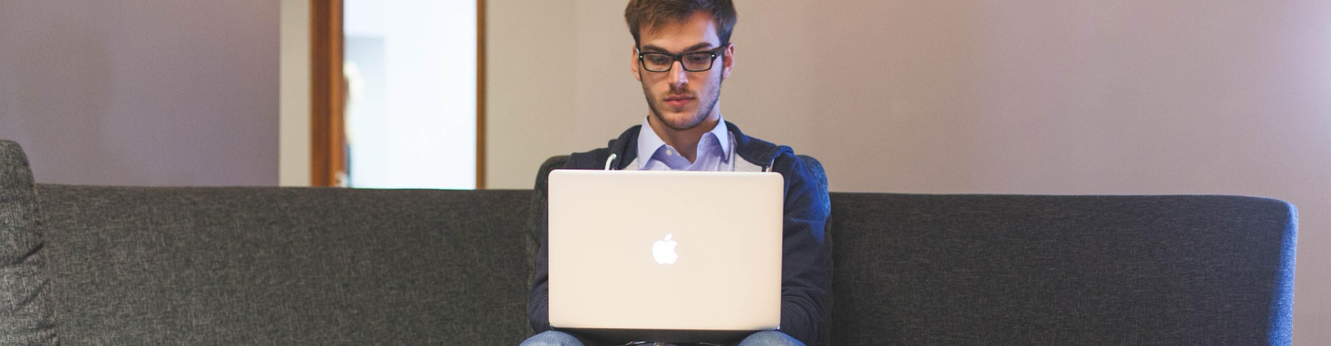 A man searching for answers and browsing an FAQ section to find guidance on cybersecurity and IT support topics.